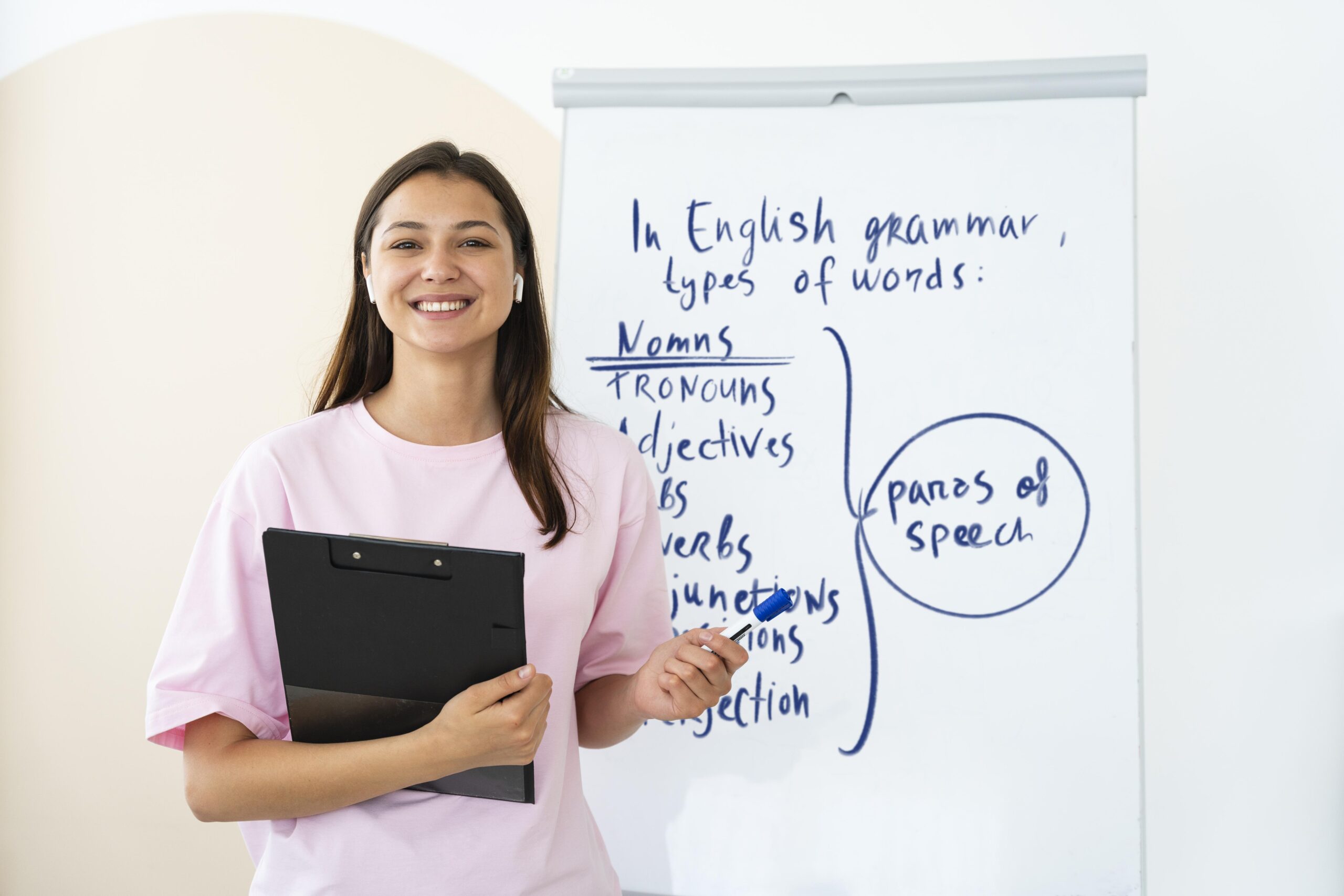 https://cmi.vic.edu.au/wp-content/uploads/2024/08/young-woman-teaching-english-lessons-scaled.jpg